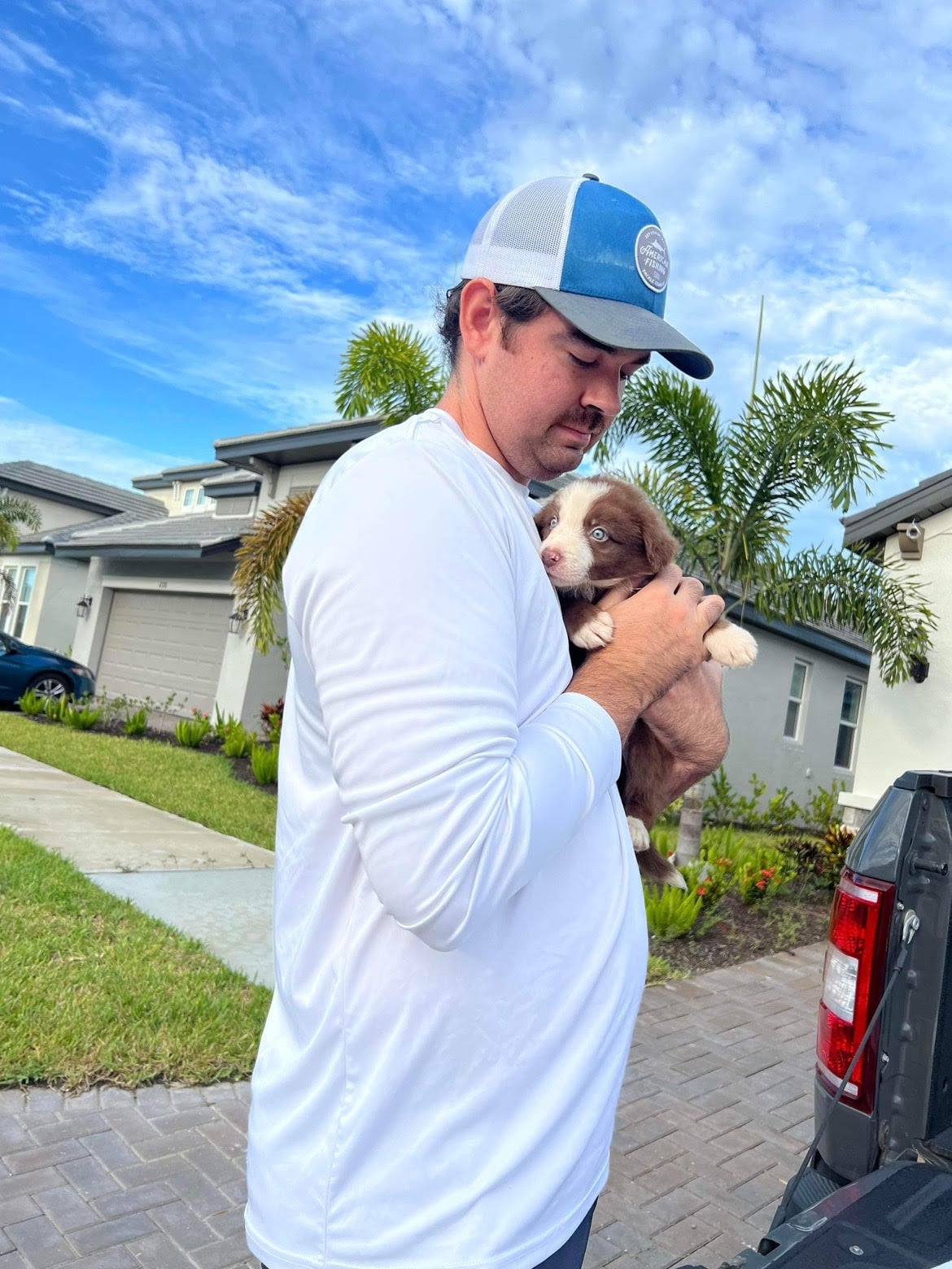 Chris S. Holding a Collie Puppy 